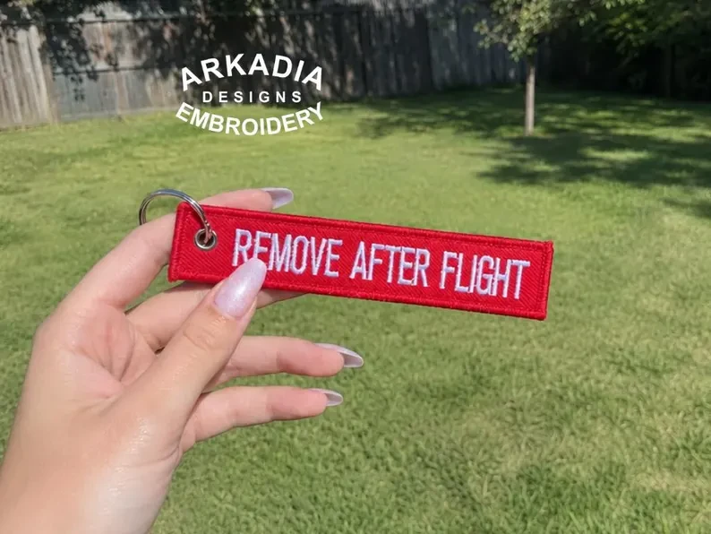 Remove After Flight embroidered keychain